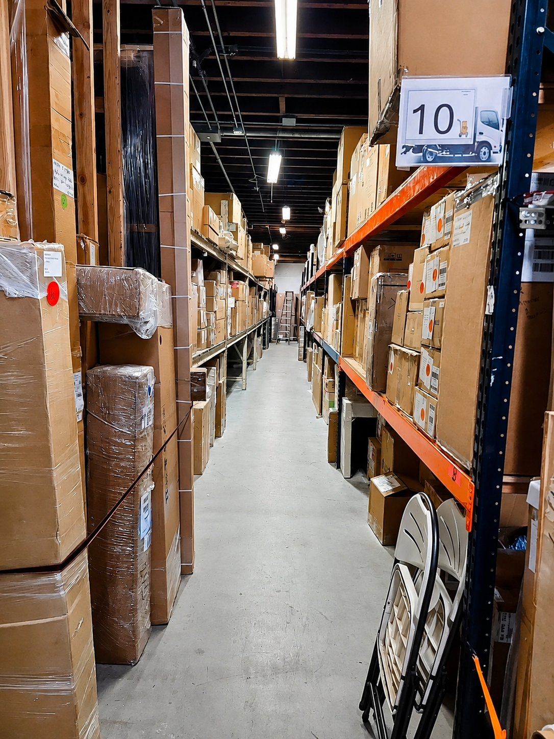 Organized Johns Delivery Service warehouse aisle
